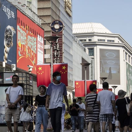 Shoppers and visitors walk along Nanjing Road East in Shanghai. A new regulation in China designed to rein in the use of algorithms goes into effect on Tuesday. Photo: Bloomberg