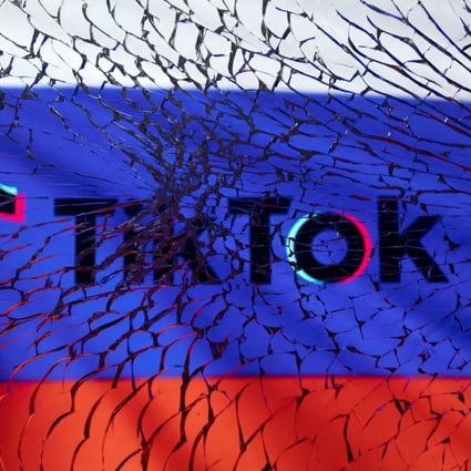 The TikTok logo and Russian flag are seen through broken glass in this illustration taken March 1, 2022. Photo: Reuters
