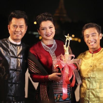 Winners of best actor awards, left to right, Lu Min, Thet Mon Myint and Tun Tun at a Myanmar Motion Picture Award Ceremony. Photo: AP