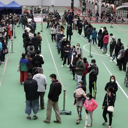 Hong Kong residents wait for coronavirus testing amid a surge in cases. Photo: Jonathan Wong