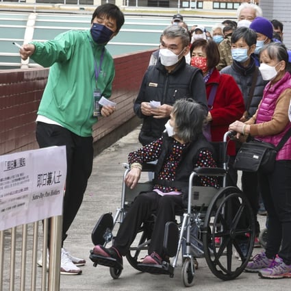 People queue outside a pop-up community vaccination centre at Tuen Mun Town Hall last month. Photo: K. Y. Cheng