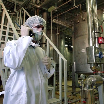 A security officer talks in a part of the Uranim Conversion Facility, just outside the city of Isfahan, Iran, on March 30, 2005. While the world’s attention has been focused on Ukraine, the Biden administration has been racing forward with other global powers towards restoring the 2015 international nuclear deal with Iran. Photo: AP