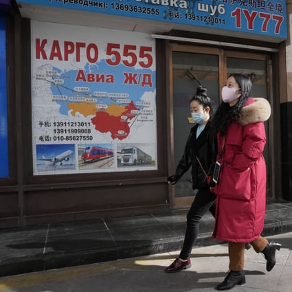 Chinese shoppers walk past Russia Market in Beijing. Photo: AP
