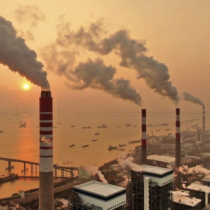 The sun sets near a coal-fired power plant on the Yangtze River in Nantong, eastern China. Photo: Chinatopix via AP