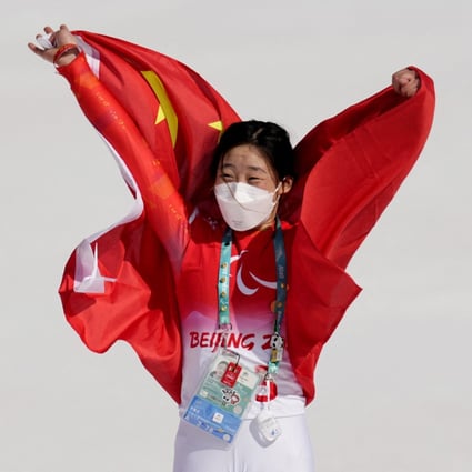Zhang Mengqiu, of China, celebrates after claiming Paralympic gold in women’s super-G standing. Photo: Reuters