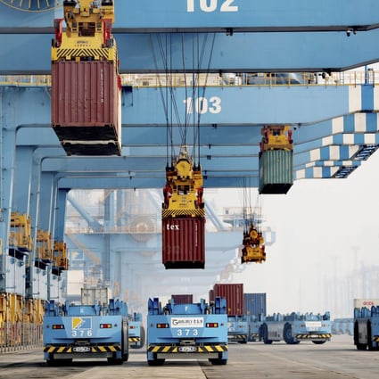 Driverless vehicles move containers at a port in Qingdao in eastern Shandong province in January 2022. Photo: AP
 