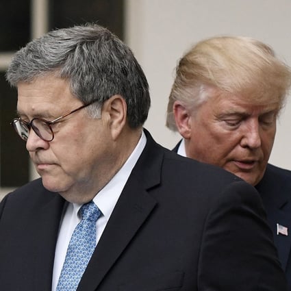 US President Donald Trump (right) and US Attorney General William Barr look on during a news conference in the Rose Garden at the White House in July 2019. Photo: TNS