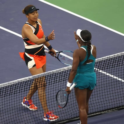 Naomi Osaka (left) shakes hands with Sloane Stevens after beating her in the first round of the BNP Paribas Open. Photo: AFP