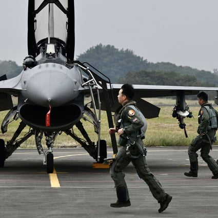 Taiwanese air force pilots run past an armed US-made F-16V fighter at a military base in southern Taiwan in January. The US is Taiwan’s main weapons supplier. Photo: AFP 