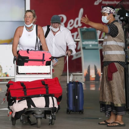 Foreign travellers are welcomed at Bali’s airport on Monday, the first day of quarantine-free entry for international passengers. Photo: EPA