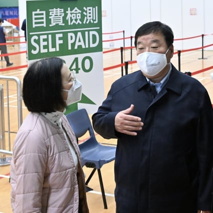 A team of mainland health experts led by Liang Wannian (second from left), head of the COVID-19 response expert panel under China’s National Health Commission, visit a community testing center in Hong Kong on Saturday. Photo: Information Services Department of the Government of the HKSAR handout via Xinhua