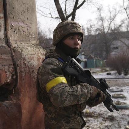 A Ukrainian soldier guards his position in the besieged city of Mariupol. Photo: AP