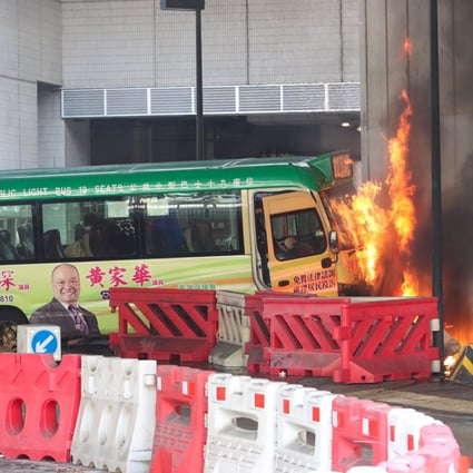 A minibus burns after crashing into the pillar of a flyover near Maritime Square in Tsing Yi on Monday.  Photo: Facebook
