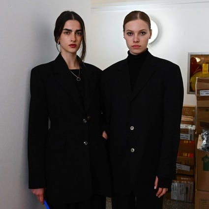 Ukrainian models Bogdana Didenko Nevodnik (left) and Valya Fedotova at the Ukrainian consulate in Milan, where they help pack supplies to be sent to war-torn Ukraine. Photo: AFP
