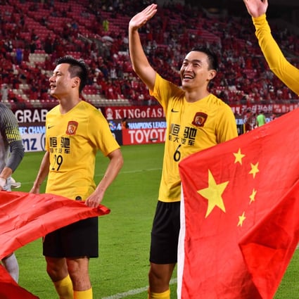 Former national team captain Feng Xiaoting (right) says the commentary surrounding Chinese football is unhelpful. Photo: AFP