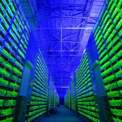 Illuminated mining rigs operate inside racks at the CryptoUniverse cryptocurrency mining farm in Nadvoitsy, Russia, on March 18, 2021. There have been fears that Russian companies could use cryptocurrency to evade sanctions. Photo: Bloomberg