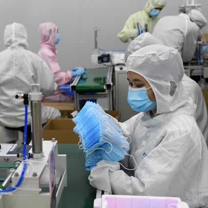 Foxconn workers make masks at a workshop in Shenzhen, southern Guangdong province, on March 17, 2020. Photo: Xinhua