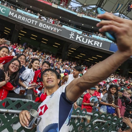Salom Yiu Kam-shing of Hong Kong takes a selfie with fans after the men’s qualifier final against Ireland on the last day of the 2019 Hong Kong Sevens at Hong Kong Stadium. Photo: Sam Tsang