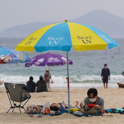 People at Shek O beach. Hong Kong Chief Executive Carrie Lam Cheng Yuet-ngor has conceded that the city’s beaches should be sealed off to avoid gatherings amid the latest wave of Covid-19. Photo: Sam Tsang