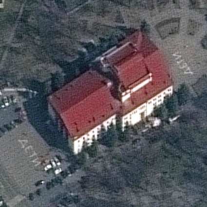 A satellite photo shows the Mariupol theatre on March 14. The word ‘children’ in large Russian script is painted on the ground outside the red-roofed building. Photo: Maxar Technologies via AFP
