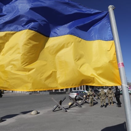The Ukrainian national flag waves in the wind in downtown Kyiv. Photo: EPA