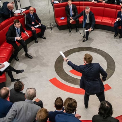 Traders in the open outcry ring at the London Metal Exchange. The 145-year-old bourse is trying to return to normal after suspending nickel trading last week. Photo: Bloomberg
