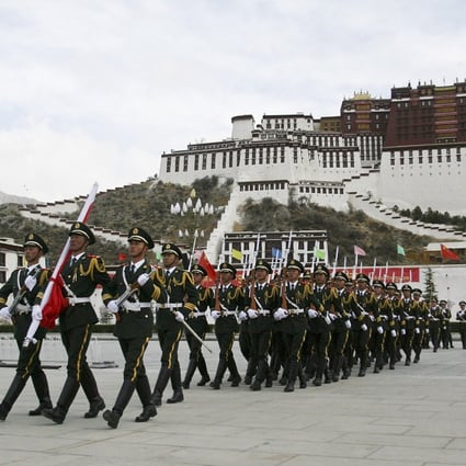 Paramilitary police hold a ceremony to mark the anniversary of the crushing of the 1959 Tibetan uprising and the Dalai Lama’s flight into exile. Photo: AP