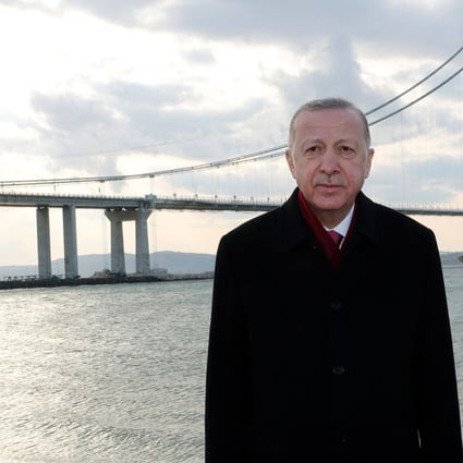 Turkey’s President Recep Tayyip Erdogan poses for photos during the inauguration of the 1915 Canakkale Bridge, in Canakkale, western Turkey. The structure connects Europe with Asia and is the world’s longest midspan suspension bridge. Photo: Handout/Turksih Presidency Press Office/AFP