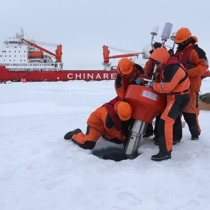 A Chinese research team sets up equipment near the icebreaker Xuelong, or “Snow Dragon”, in the Arctic Ocean. Photo: Xinhua
