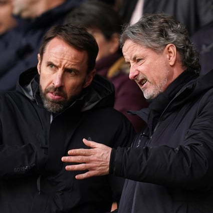 England manager Gareth Southgate (left) chats with Wolverhampton Wanderers technical director Scott Sellars during a Premier League game at Molineux Stadium. Photo: DPA
