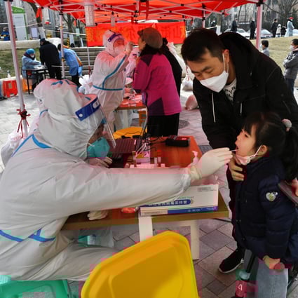 A child gets tested for Covid-19 in Qingdao, Shandong province. Photo:  Xinhua 