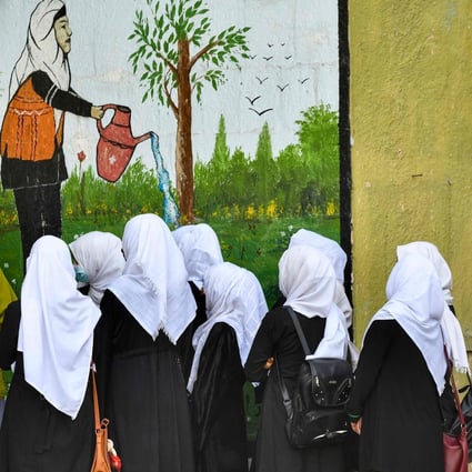 Girls arrive at their school in Kabul on Wednesday. Hours later, they were ordered to go home. Photo: AFP 