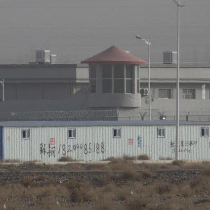 In this Monday, Dec. 3, 2018, file photo, a guard tower and barbed wire fences are seen around a facility in the Kunshan Industrial Park in Artux in western China’s Xinjiang region. This is one of a growing number of internment camps in the Xinjiang region, where by some estimates 1 million Muslims are detained, forced to give up their language and their religion and subject to political indoctrination. (AP Photo/Ng Han Guan, File)