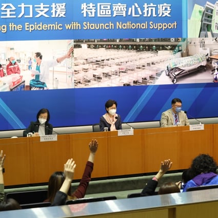 Media representatives raise their hands to ask questions at a press conference chaired by Chief Executive Carrie Lam Cheng Yuet-ngor (centre) on March 14. Photo: May Tse