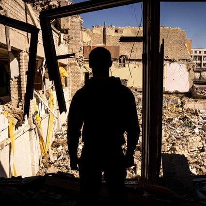 A man stands inside a damaged school in the city of Zhytomyr, northern Ukraine, on Wednesday. Photo: AFP
