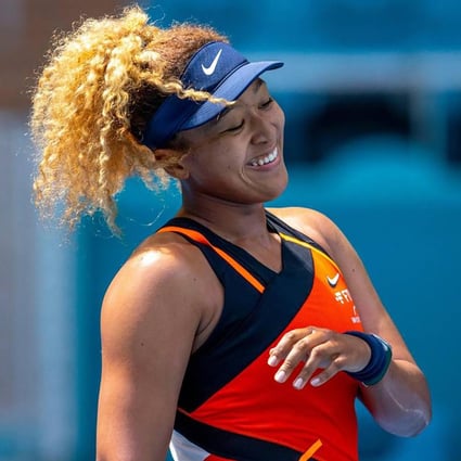 Naomi Osaka of Japan reacts after scoring a point against Astra Sharma of Australia during their first round match at the Miami Open. Photo: TNS