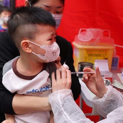 Children receive free Covid-19 jabs during a vaccination event at Hoi Ying Estate in Cheung Sha Wan on March 22. Photo: Nora Tam