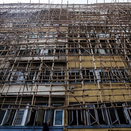 Bamboo scaffolding covers an old residential building in Hong Kong on March 18. Photo: AFP