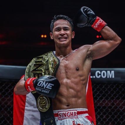 Superbon celebrates after beating Marat Grigorian to retain his featherweight kickboxing title at ONE X in Singapore. Photos: ONE Championship