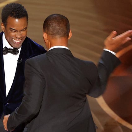 Will Smith hits Chris Rock at the Oscars ceremony on Sunday. It was a slap heard around the world, but not the first shocking moment at an Academy Awards presentation. Photo: Reuters