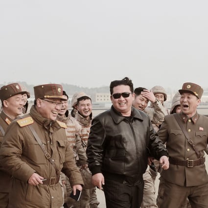 North Korean leader Kim Jong-un with military officials during the launch of the Hwasong-17 ICBM on March 24. Photo: KCNA via Reuters