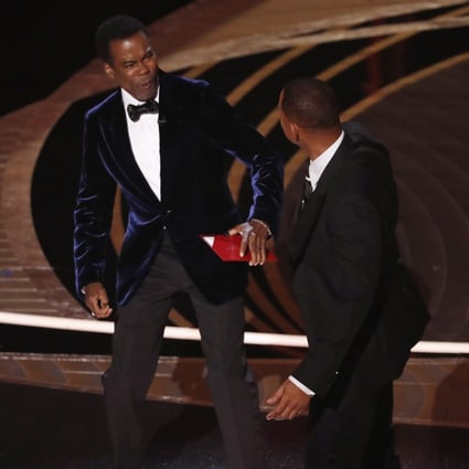 Actor Will Smith (right) swings at US actor Chris Rock during the Academy Awards ceremony at the Dolby Theatre in Hollywood. Photo: EPA-EFE