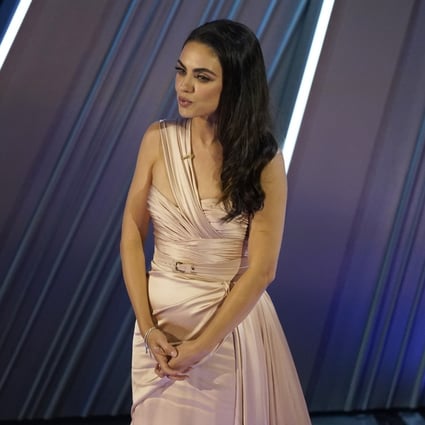 Mila Kunis introduces a performance by Reba McEntire at the Oscars on Sunday. The actress, who was born in Ukraine,  used the moment to speak up for its people following Russia’s military invasion of the country. Photo: AP