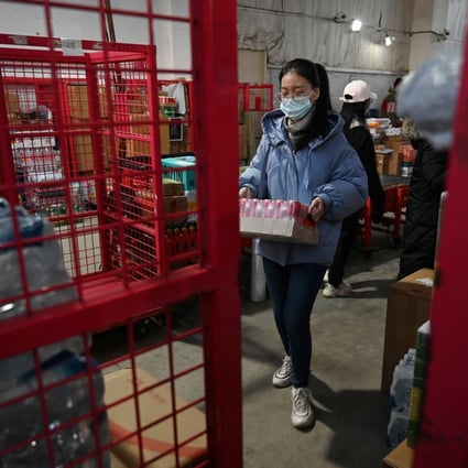 A worker prepares a package for delivery at a JD.com distribution centre. Photo: AFP