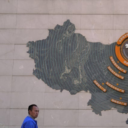 A map showing China Evergrande Group’s development projects in China on a wall at the Evergrande City plaza in Beijing on September 21, 2021. Photo: AP