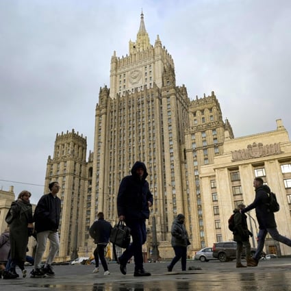 People walk past the Russian foreign ministry headquarters in Moscow on Tuesday. Photo: AFP