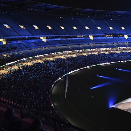 Images are projected on the ground during a memorial service for Shane Warne at the Melbourne Cricket Ground in Melbourne, Australia, on Wednesday. Warne, widely regarded as one of the top cricket players of all time, died on March 4 while on vacation with friends in Thailand. Photo: AAP Image via AP