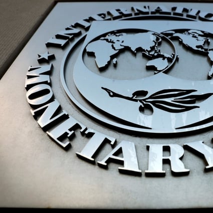 The International Monetary Fund (IMF) logo is seen outside the headquarters building in Washington. Photo: Reuters
