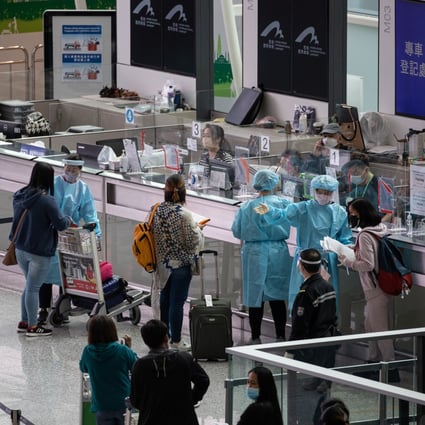 Passengers landing at Hong Kong International Airport wait to be transported to quarantine hotels. The amendments to rules for travellers and airlines have been welcomed in Hong Kong, but have also caused some uncertainty as flights may still be suspended and arrivals made to quarantine beyond the new seven-day requirement if they test positive for Covid-19. Photo: EPA-EFE