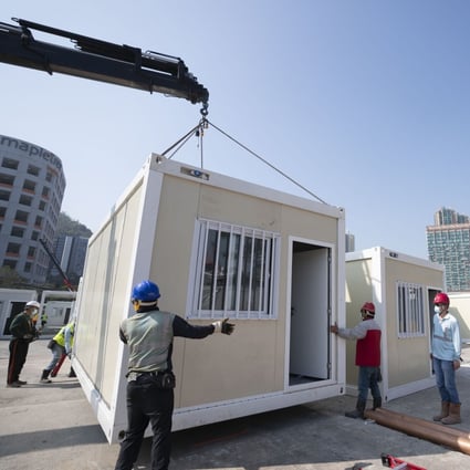 Construction workers put together the Tsing Yi mobile cabin hospital in Hong Kong on February 26, part of the rapid construction of temporary isolation and treatment facilities amid a surge in Covid-19 infections. Photo: Xinhua